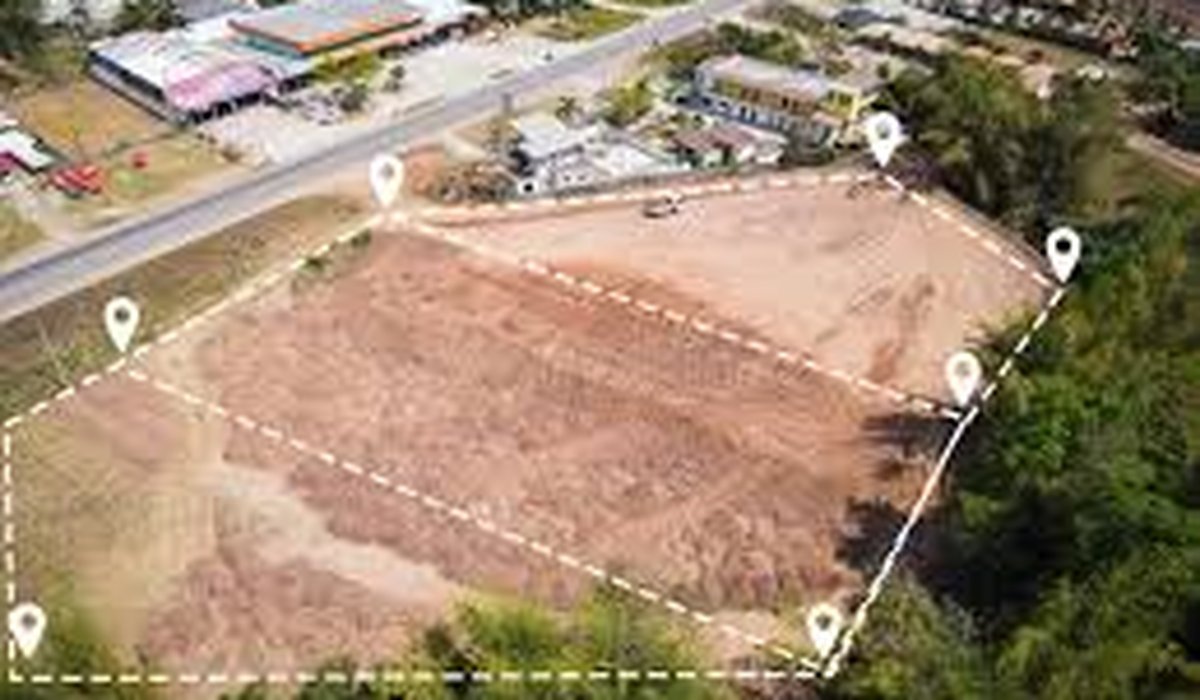 Aerial parcel with dashed boundary near roadway (sample deal)